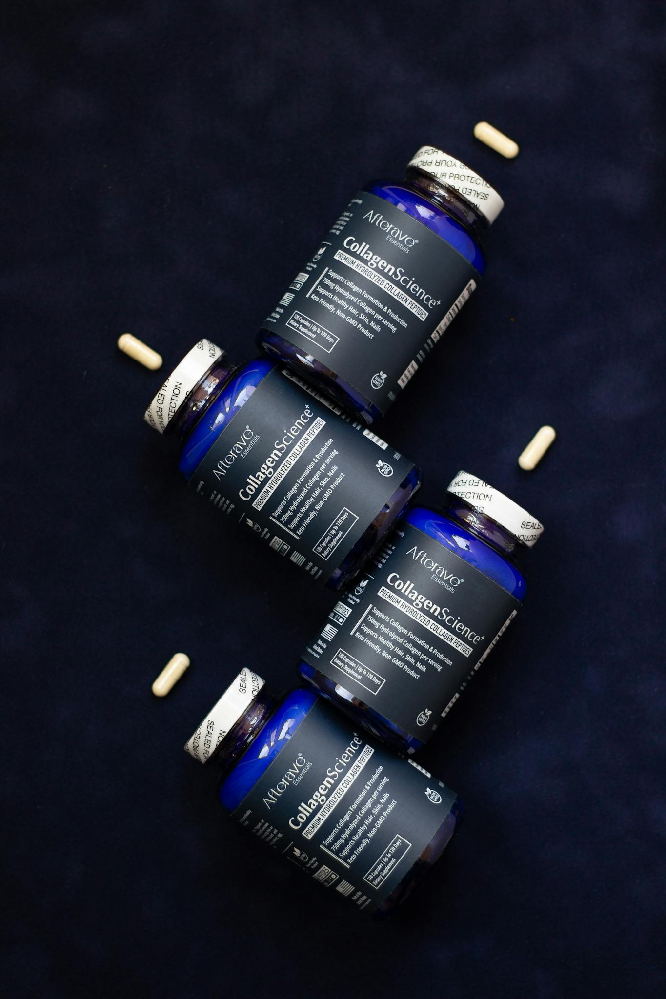 AltNeve collagen supplements arranged artfully on a navy blue surface with capsules.