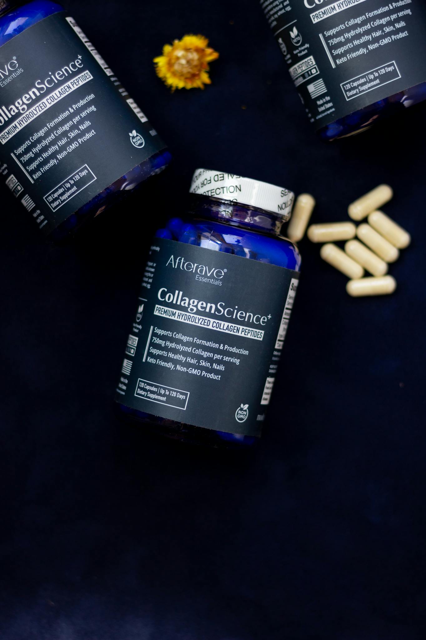 Premium hydrolyzed collagen peptides for skin health, shown with capsules on dark setup.